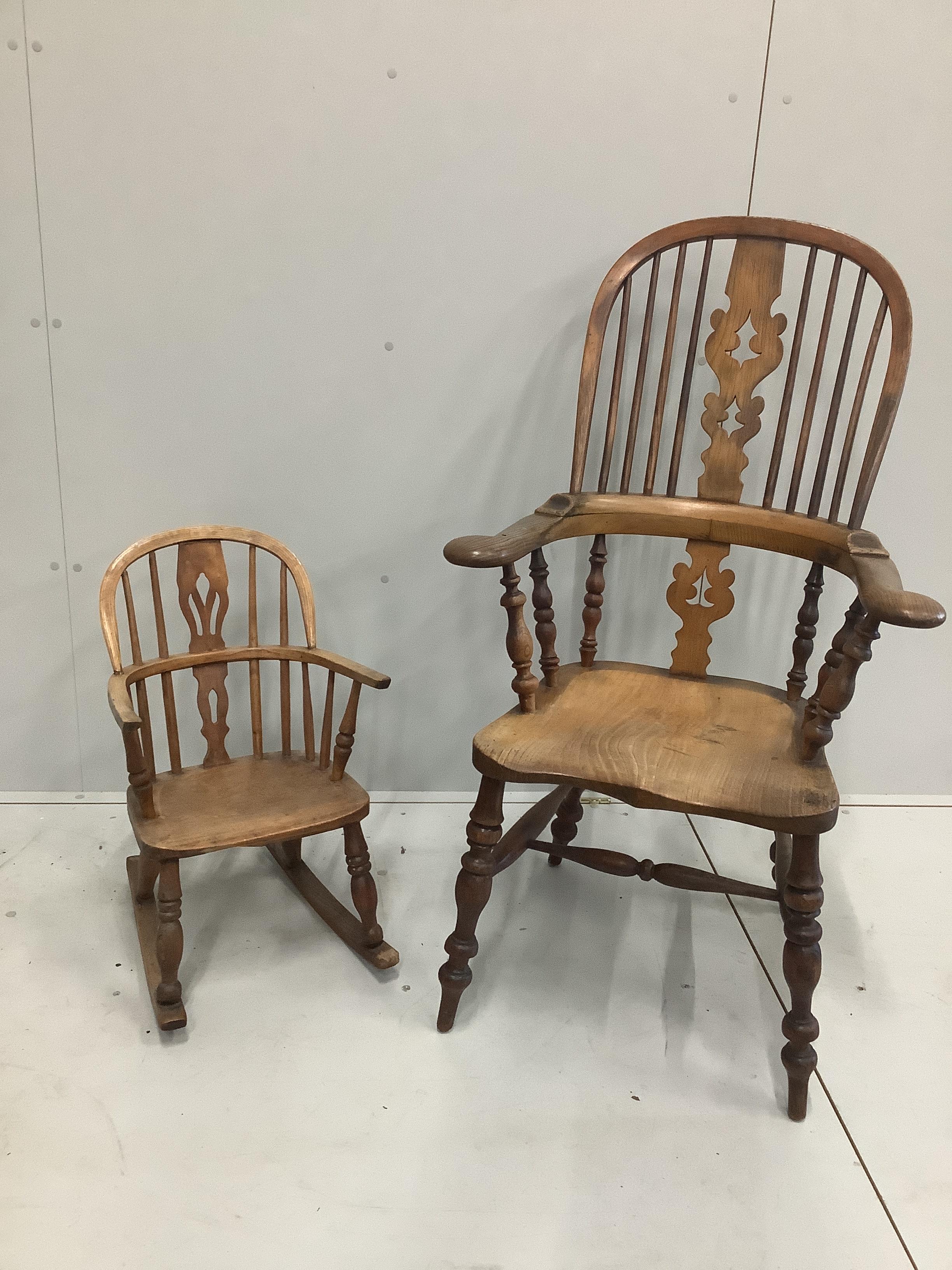 A 19th century turned comb back elm, ash and beech Windsor elbow chair with pierced splat, height 114cm, together with a child's rocking chair, height 63cm